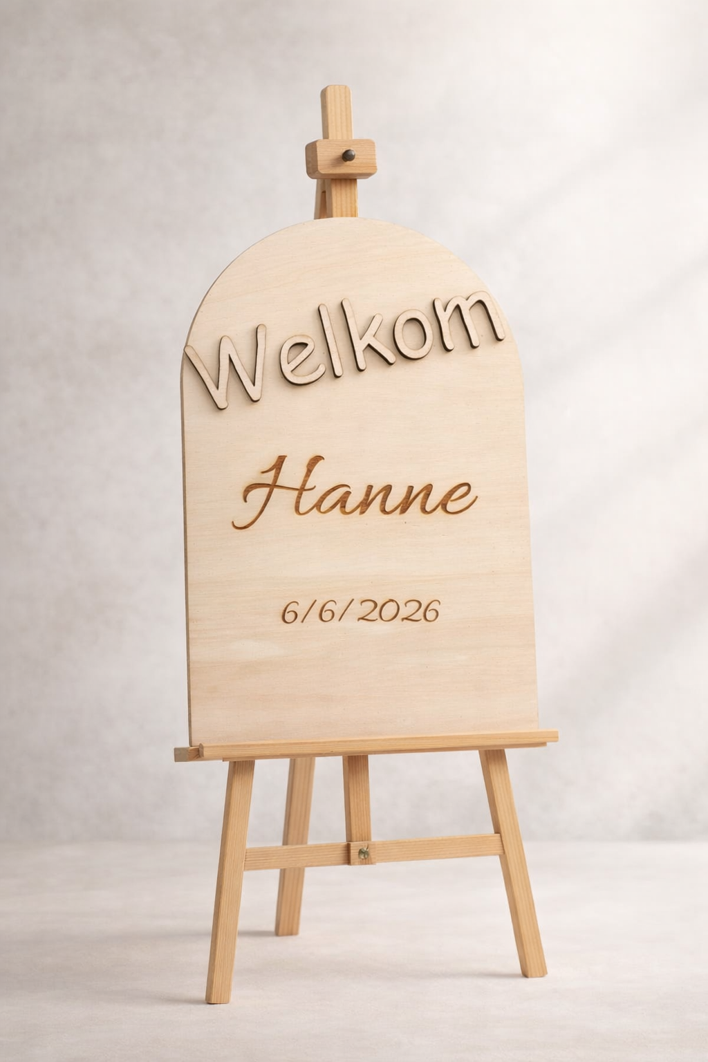 Welkomstbord met naam boog op ezel
